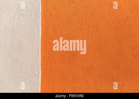 Facade plaster background. Single-ply monolithic plaster decorative background. Single layer scraped cement plaster wallpaper. Exterior building struc Stock Photo