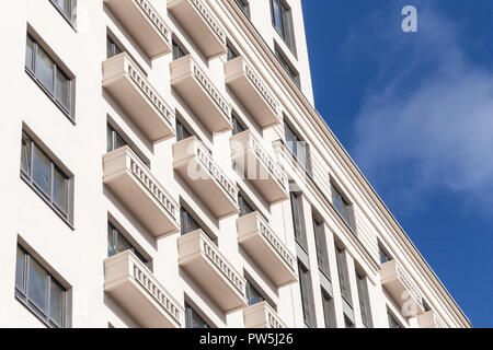 Facade plaster background. Single-ply monolithic plaster decorative background. Single layer scraped cement plaster wallpaper. Exterior building struc Stock Photo