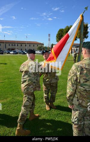 Brig. Gen. Eugene LeBoeuf, acting Command General, U.S. Army Africa, passes the USARAF Colors to Command Sgt. Maj. Jeremiah Inman, USARAF Command Sgt. Maj. during an assumption of responsibility ceremony on Hoekstra Field in Vicenza, Italy, September 20, 2017.   . Stock Photo