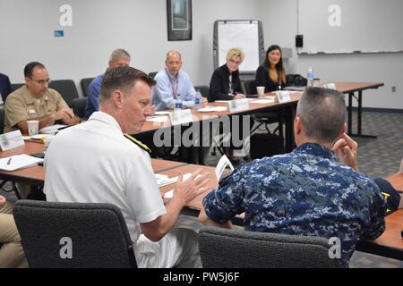 PENSACOLA, Fla. -- Commander, Naval Education and Training Command (NETC) Rear Adm. Kyle Cozad speaks to NETC domain commanding officers, executive directors and technology specialists during the 'Big Six' Innovative Technology Workshop Sept. 21 at the Center for Naval Aviation Technical Training (CNATT) headquarters aboard Naval Air Station Pensacola, Florida. CNATT hosted the day-long workshop during which NETC domain leadership discussed leveraging technology to further education. Stock Photo