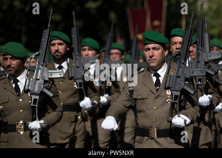 Members of military forces in Granada seen marching on during the National Day parade. In Spain each October 12th is celebrated the Hispanic Day, this festivity commemorates the arrival of Christopher Colombus to América. Stock Photo