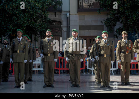 Members of military forces in Granada seen during the National Day military parade. In Spain each October 12th is celebrated the Hispanic Day, this festivity commemorates the arrival of Christopher Colombus to América. Stock Photo