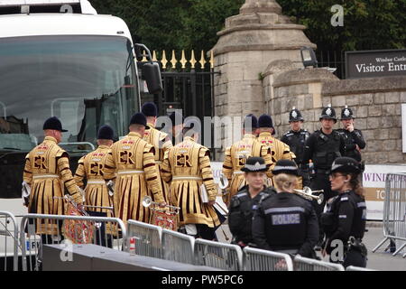 Windsor, UK. 12th October, 2018. Trumpeters head to their coach after the wedding between HRH Princess Eugenie and Jack Brooksbank in St George's Chapel, Windsor Castle, UK. Credit: Andy Stehrenberger/Alamy Live News Stock Photo