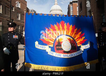 London UK.13th October 2018. Representatives from every FBU firefighting Brigade across the Britain march across Millennium Bridge to Southwark Cathedral after a wreath-laying ceremony for fallen colleagues at the National Firefighters Memorial, St Pauls Credit: amer ghazzal/Alamy Live News Stock Photo