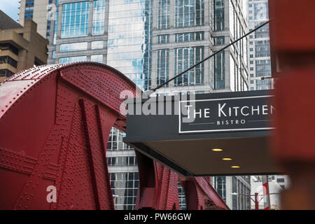 CHICAGO, IL, October 10, 2018 : Beautiful view of the street along the bridge with his restaurants like the Kitchen. Over half a million people work d Stock Photo