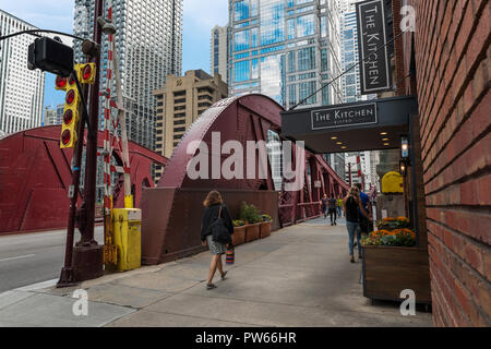 CHICAGO, IL, October 10, 2018 : Beautiful street and people is walking along the bridge. Over half a million people work downtown Chicago. Urban spiri Stock Photo