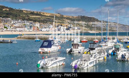 A panoramic view of Lyme Harbour Cobb in the coastal town of Lyme Regis in Dorset. Stock Photo