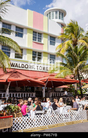 Miami Beach Florida,Ocean Drive,New Year's Day,Waldorf Tower,restaurant restaurants food dining cafe cafes,al fresco sidewalk outside tables,diners,wo Stock Photo