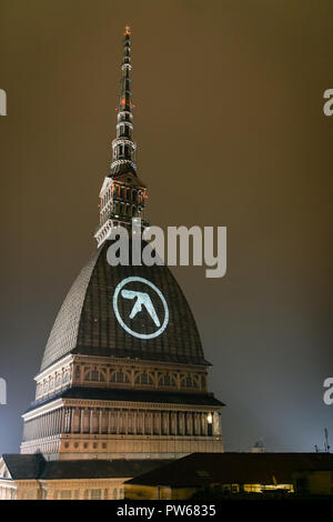 Turin, Italy. 11th Oct, 2018. Aphex twin logo appears on the Mole Antonelliana, symbol of Turin before the Club to Club festival where he will perform one of three world show Credit: Daniele Baldi/Pacific Press/Alamy Live News Stock Photo