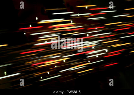 Colored blurred lines of light on dark background Stock Photo