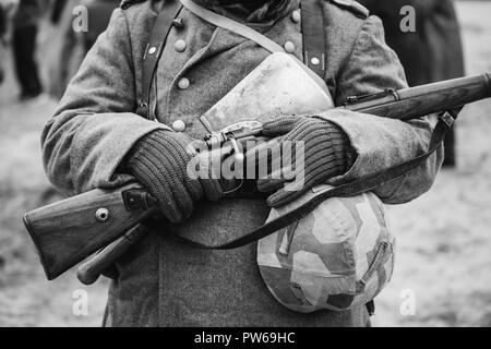 Close Up Of German Military Ammunition Of A German Wehrmacht Soldier At World War II. Warm Autumn Clothes, Soldier's Overcoat, Gloves, Helmet, Sapper  Stock Photo