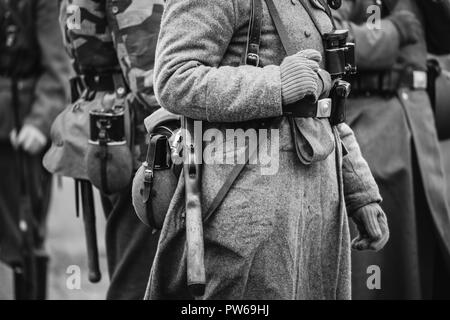 Close Up Of German Military Ammunition Of A German Wehrmacht Soldier At World War II. Warm Autumn Clothes, Soldier's Overcoat, Gloves, Helmet, Pouch,  Stock Photo