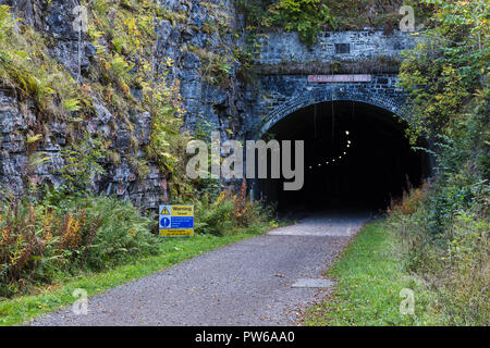 One of the many tunnels built for Midland Railway in the 1870s.  For a long time the tunnels along Monsal Trail were closed but they are now lit to al Stock Photo