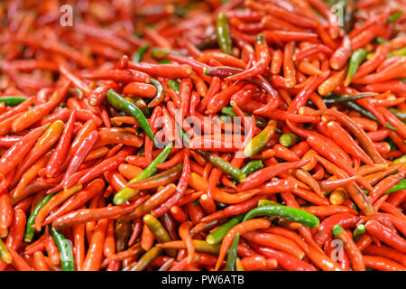 Fresh red chillies at a market in Thailand Stock Photo