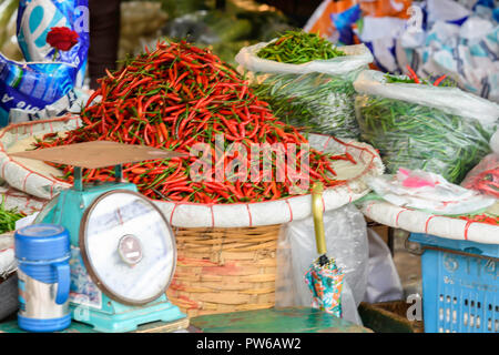 Fresh red chillies at a market in Thailand Stock Photo