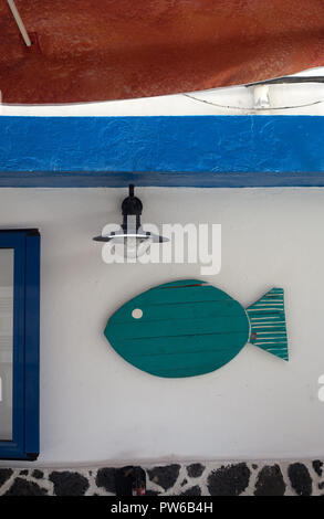 Fun decoration a a restaurant's wall in the pretty fishing village of El Cotillo, La oliva, Fuerteventura, Canary Islands, Spain Stock Photo