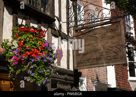 UK, Kent, Canterbury, Palace Street, carved wooden sign of Conquest House Art Gallery and shop located in ancient Pilgrim's Hall Stock Photo