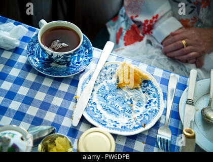 over head view of traditional morning tea and toast served in blue oriental crockery dishes. Stock Photo