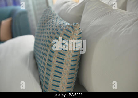 Fabric pillows in a bed Stock Photo
