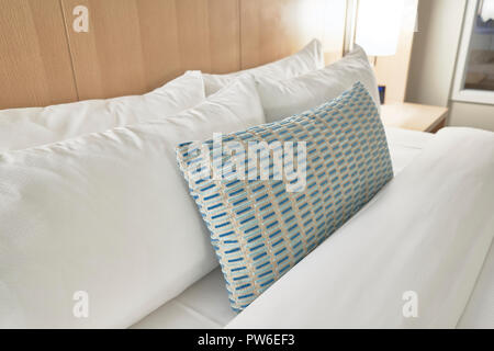 Fabric pillows in a bed Stock Photo