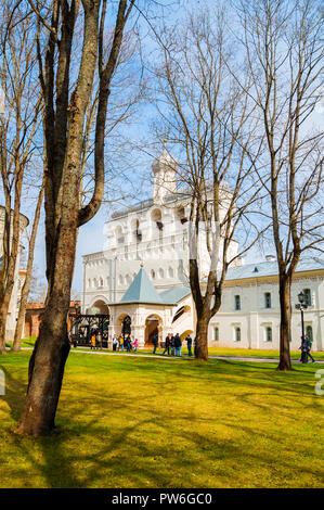 Veliky Novgorod, Russia - April 29, 2018. The belfry of St Sophia Cathedral in Veliky Novgorod Kremlin park and tourists walking along in spring day Stock Photo