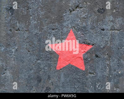 five-pointed red star on a black background Stock Photo