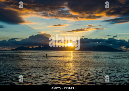 Dramatic sunset over Moorea, Papeete, Tahiti Stock Photo