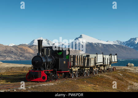 Historic mine train in front of the Kongsfjorden, Ny-Alesund, Spitsbergen, Svalbard Islands, Svalbard and Jan Mayen, Norway