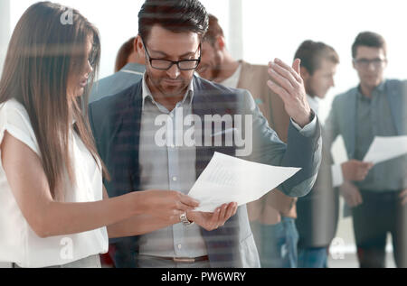boss and assistant to discuss the work schedule Stock Photo