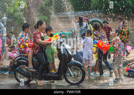 Chiang Rai, Thailand - April 13, 2018 : Songkran festival at Suan Tung Lae Khom Chiang Rai Park in Chiang Rai. People funny playing water. Stock Photo