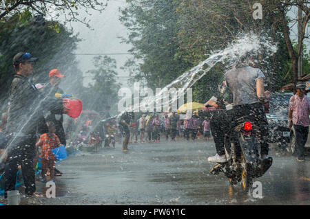 Chiang Rai, Thailand - April 13, 2018 : Songkran festival at Suan Tung Lae Khom Chiang Rai Park in Chiang Rai. People funny playing water. Stock Photo