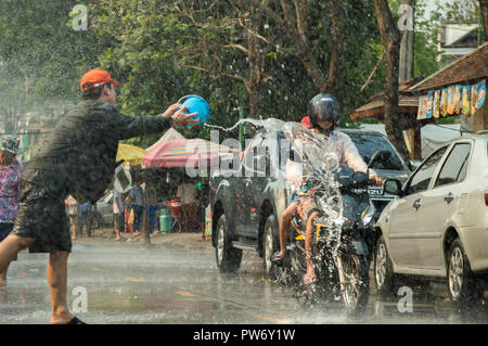 Chiang Rai, Thailand - April 13, 2018 : Songkran festival at Suan Tung Lae Khom Chiang Rai Park in Chiang Rai. People funny playing water. Stock Photo