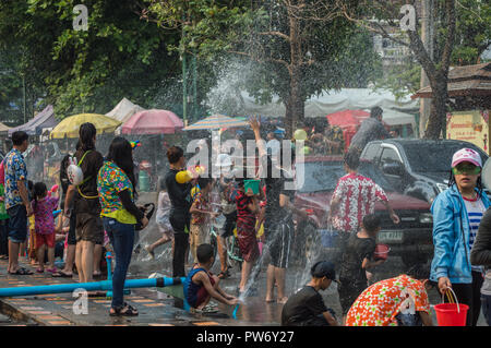 Chiang Rai, Thailand - April 13, 2018 : Songkran festival at Suan Tung Lae Khom Chiang Rai Park in Chiang Rai. People funny playing water. Stock Photo