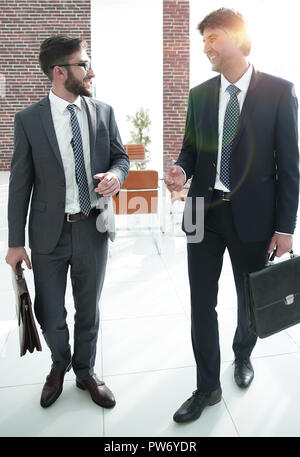 Two company employees discuss business issues Stock Photo