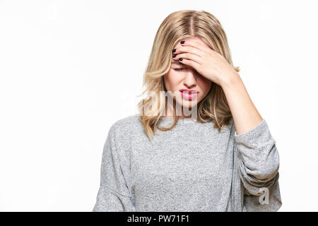 Young Woman Having Headache. Stressed Exhausted Young Woman Having Strong Tension Headache. Waist up Portrait Of Beautiful Woman Suffering From Migrai Stock Photo