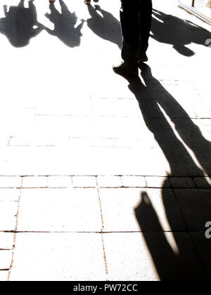 Black and white silhouette of people crowd walking down the pedestrian ...