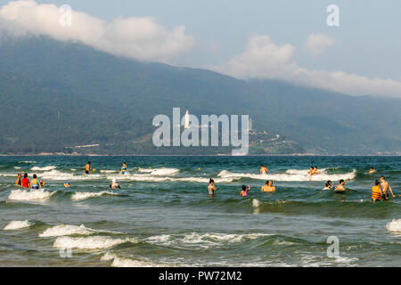 People enjoying a day out on the beach at Da Nang Vietnam Stock Photo