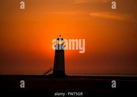 Point of Ayr lighthouse at sunset on Talacre beach, North Wales coast Stock Photo