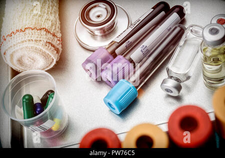 Vials and blood samples in a hospital tray, conceptual image Stock Photo