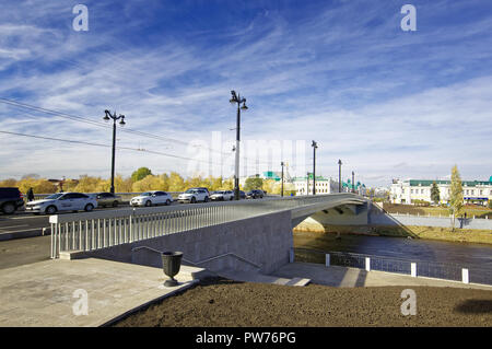 Editorial. Omsk, Russia - October 09, 2018. A new, completely reconstructed Jubilee bridge over the Om river. View to Lenin Street Stock Photo