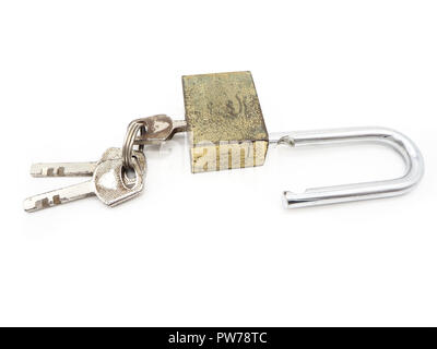Keys stuck in a old lock isolated on a white background. Stock Photo
