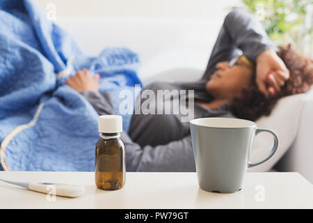 Black woman feeling sick and seasonal flu symptoms
