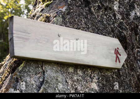 Wooden Trail Sign In A Forest For Hikers close-up Stock Photo