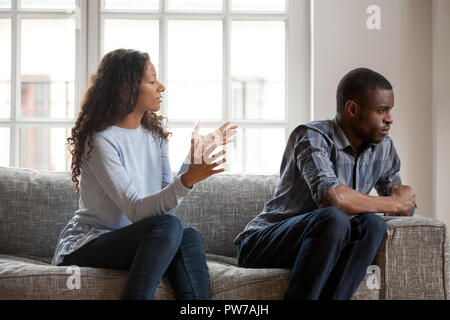 African woman and man quarrelling at home Stock Photo