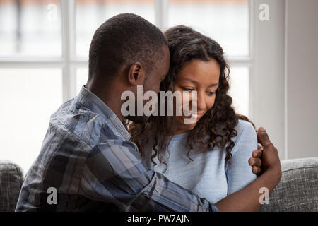 Black couple in love after quarrelling at home Stock Photo
