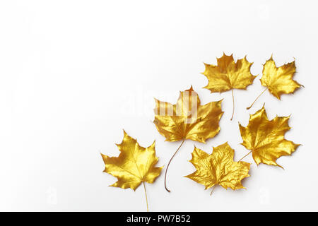 Autumn composition. Frame made of autumn golden leaves on light grey background. Flat lay, top view Stock Photo