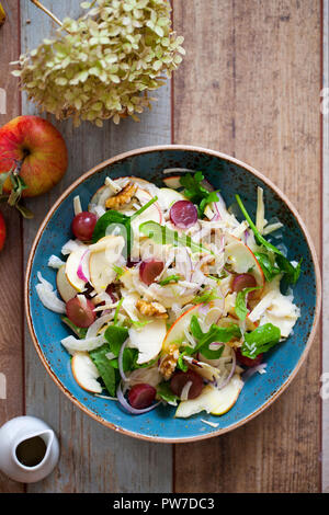 Apple and fennel salad with walnuts and greens Stock Photo