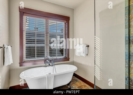 Master bathroom with a freestanding clawfoot tub. Northwest, USA Stock Photo