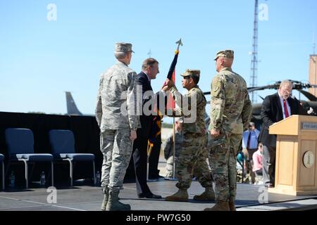 Gov. Christopher T. Sununu passes the colors to Brig. Gen. David J. Mikolaities during change of command ceremony at Pease Air National Guard Base, Sept. 23, 2017. Brig. Gen. David Mikolaities assumes duties as the Adjutant General, New Hampshire National Guard from Maj. Gen. William Reddel. (N.H. National Guard Stock Photo