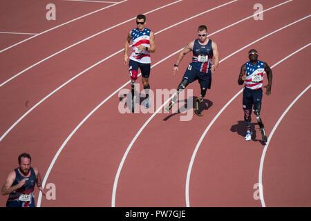Athletes compete in a Men's IT2 200m Heat during the 2017 Invictus Games at the York Lions Stadium in Toronto, Canada, Sept. 24, 2017. More than 550 wounded, ill and injured servicemen and women from 17 allied nations are expected to compete. Stock Photo
